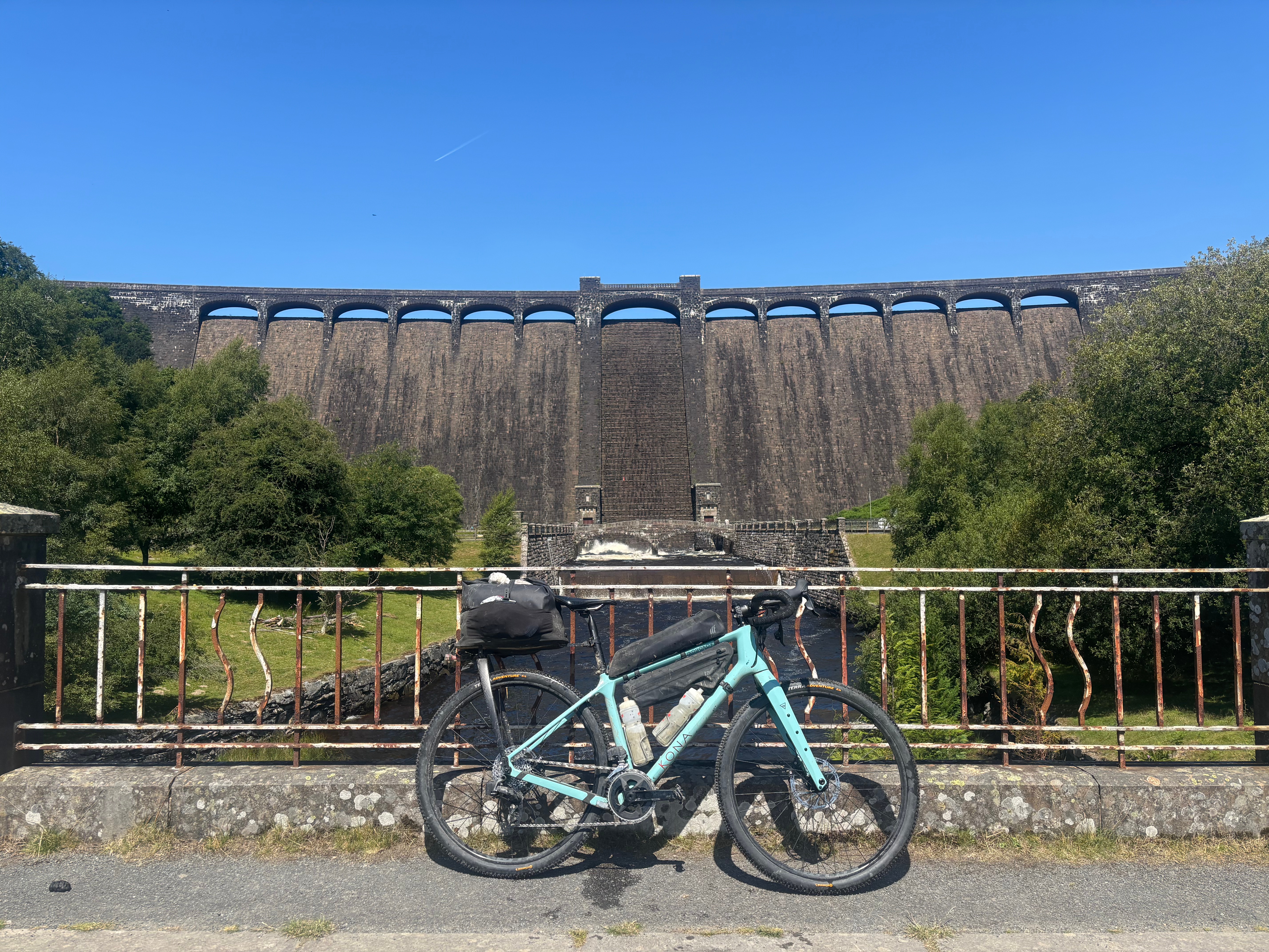 Kona Ouroboros in front of a reservoir