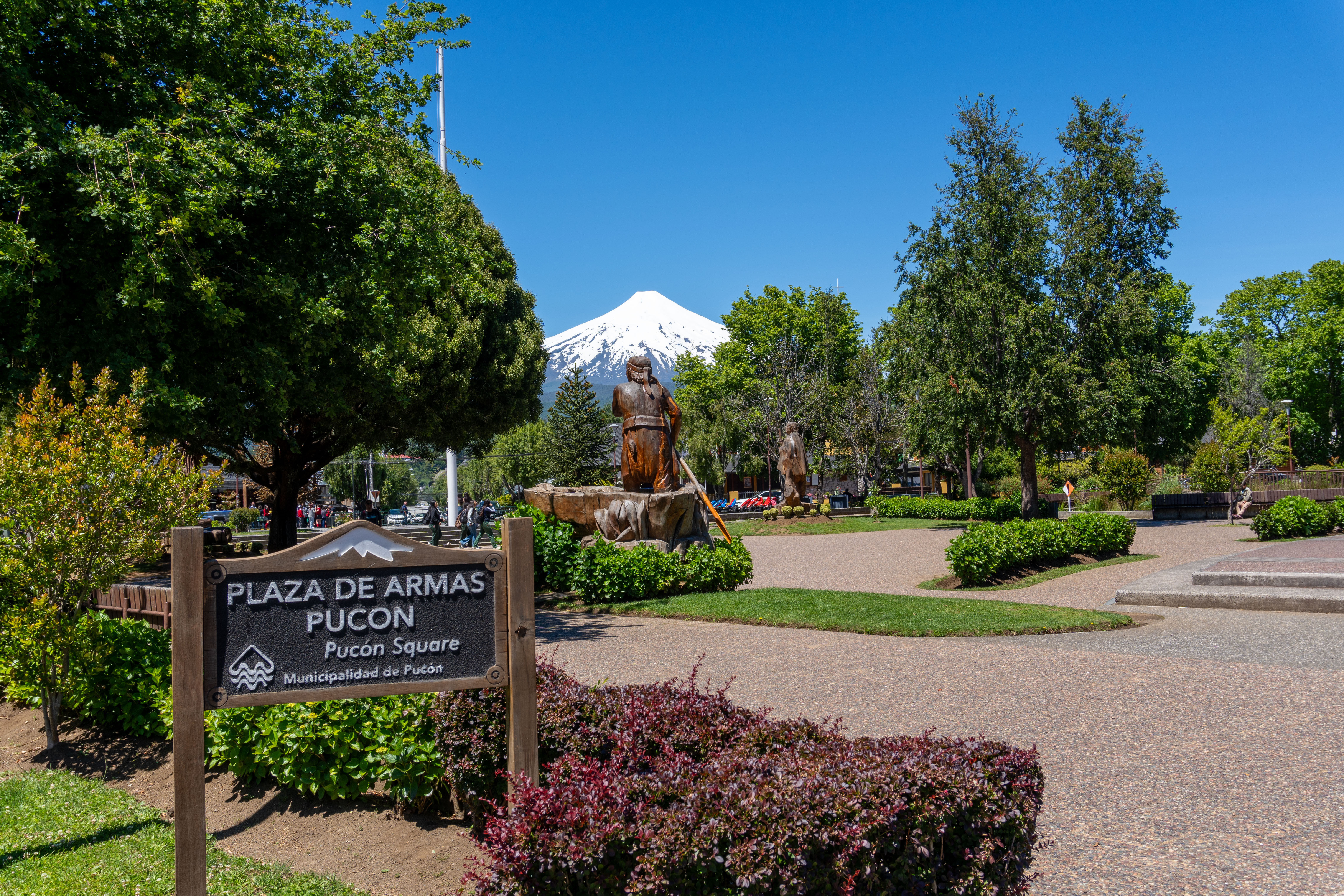 View of the plaza at Pucon with Villarica volcano in the distance