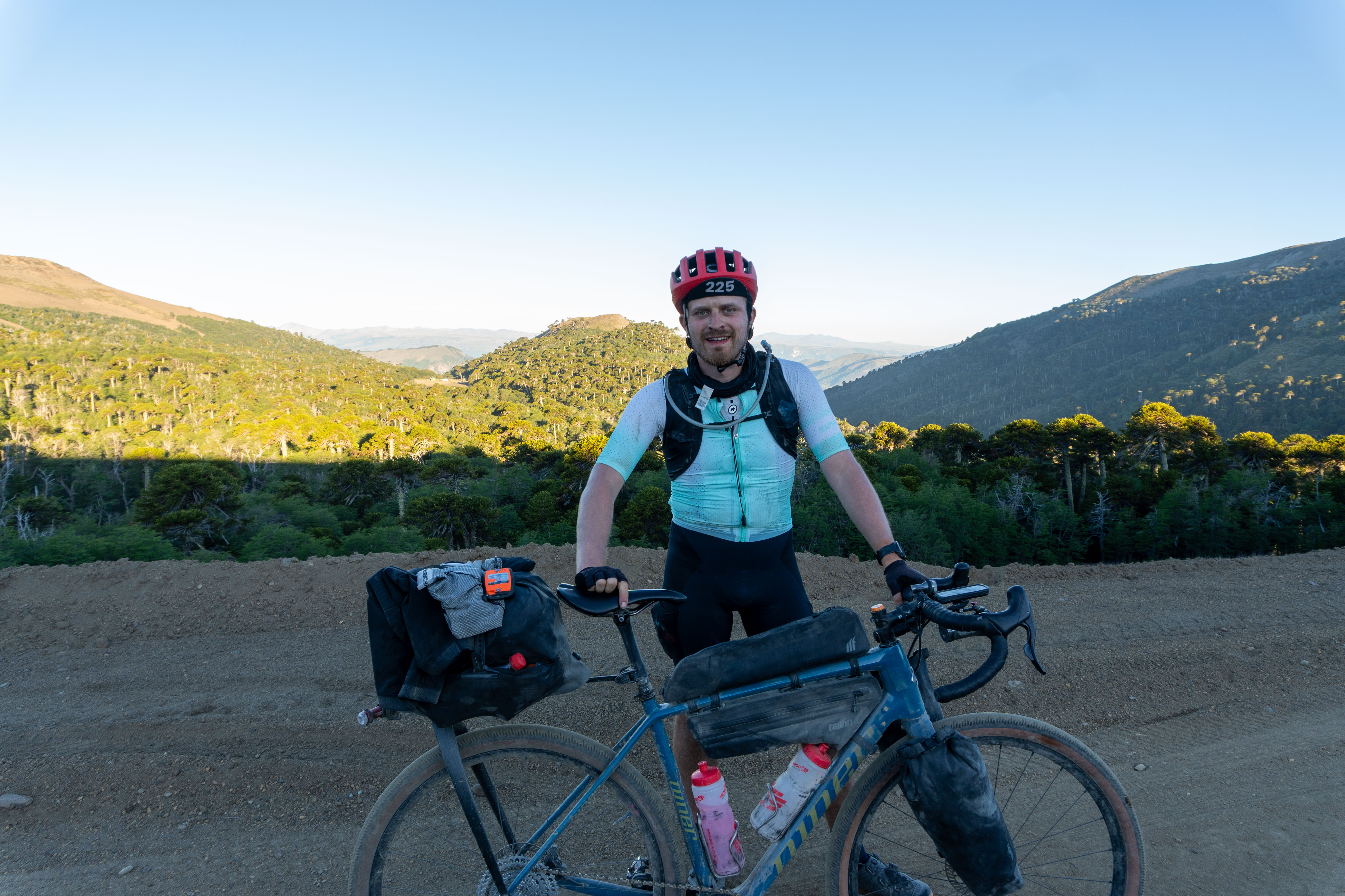Oscar Huckle standing with Niner RLT 9 RDO on a Chilean gravel road