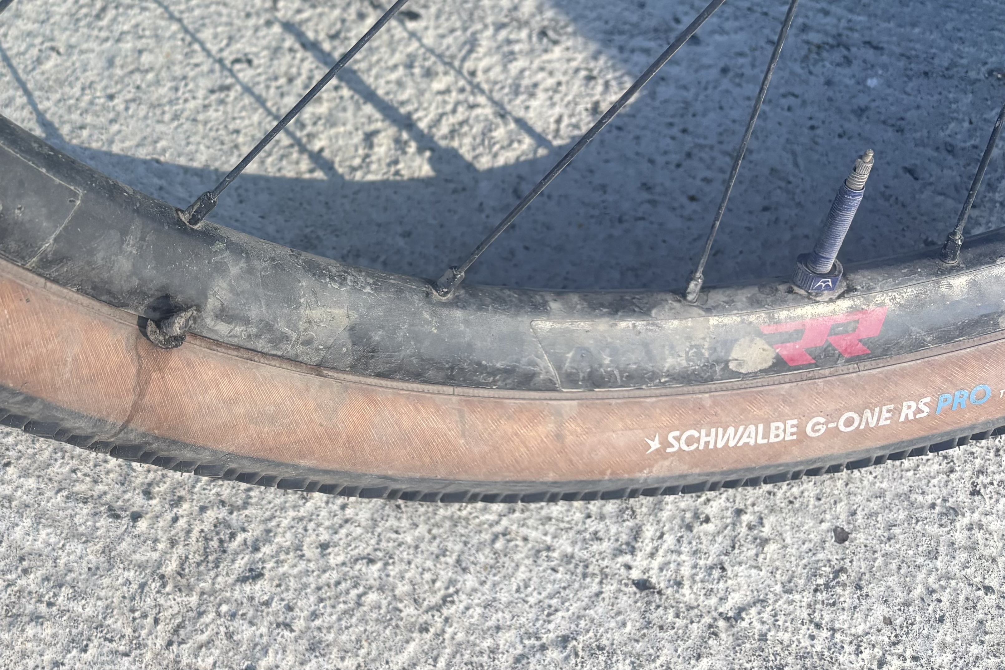 Schwalbe G-One RS Pro tyre with a plug in it